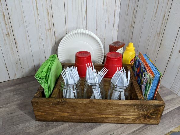 Grill Mate table caddy filled with condiments and utensils