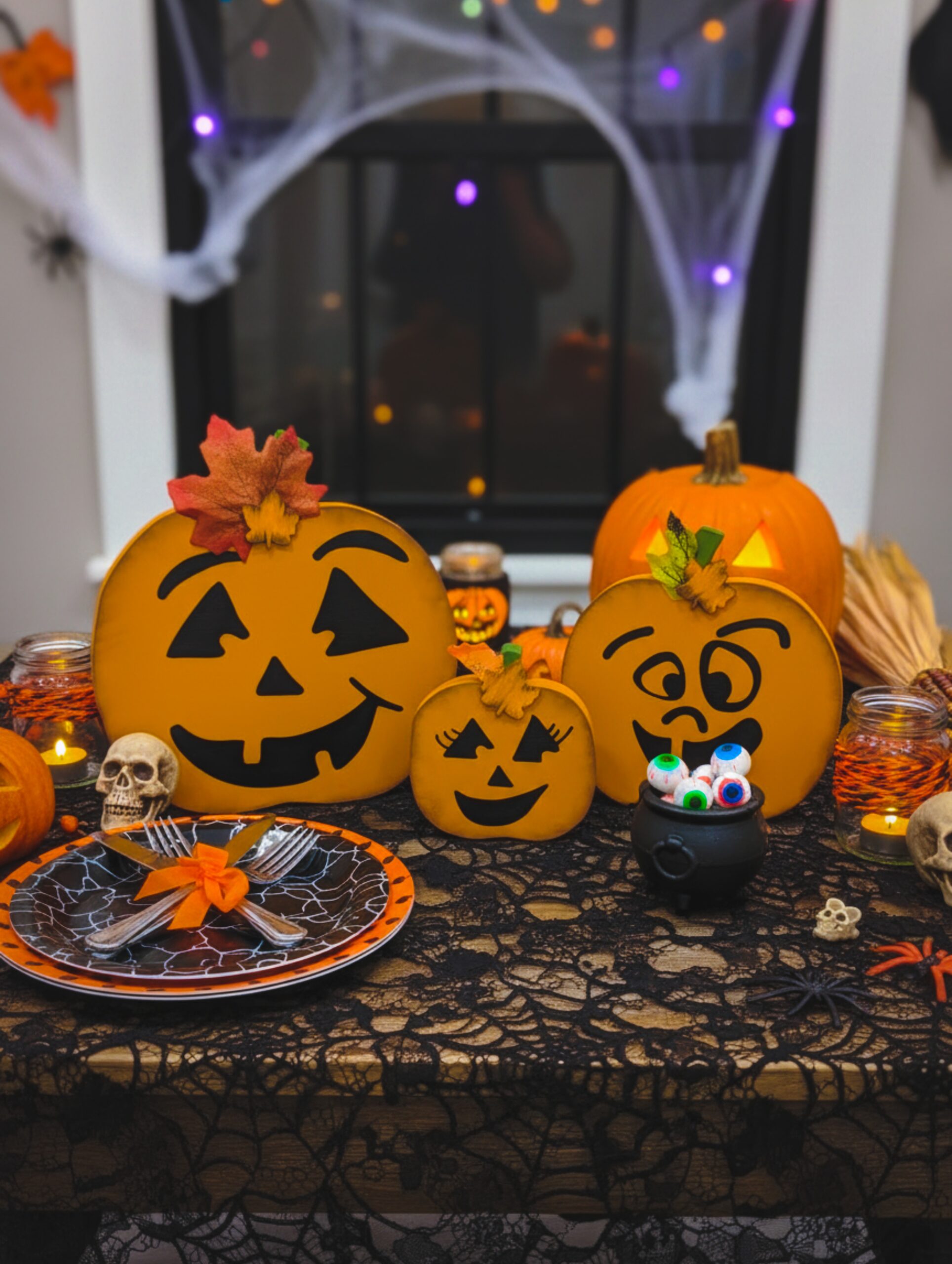 Jack-O-Lantern Pumpkins displayed on a festive Halloween table